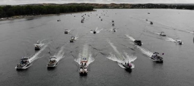 Photo by Colton Hall: https://www.newscenter1.tv/video-drone-footage-of-trump-2020-boat-parade-in-pierre/pic/408326/