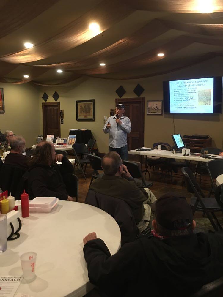 Mike Weiler, COS volunteer, shares information during the town hall meeting at the Branding Iron Steakhouse.