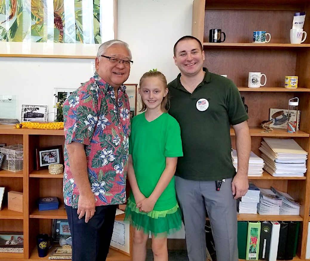 Jake and Ariel Wilson (right and center) visit state Senator Clarence Nishihara.